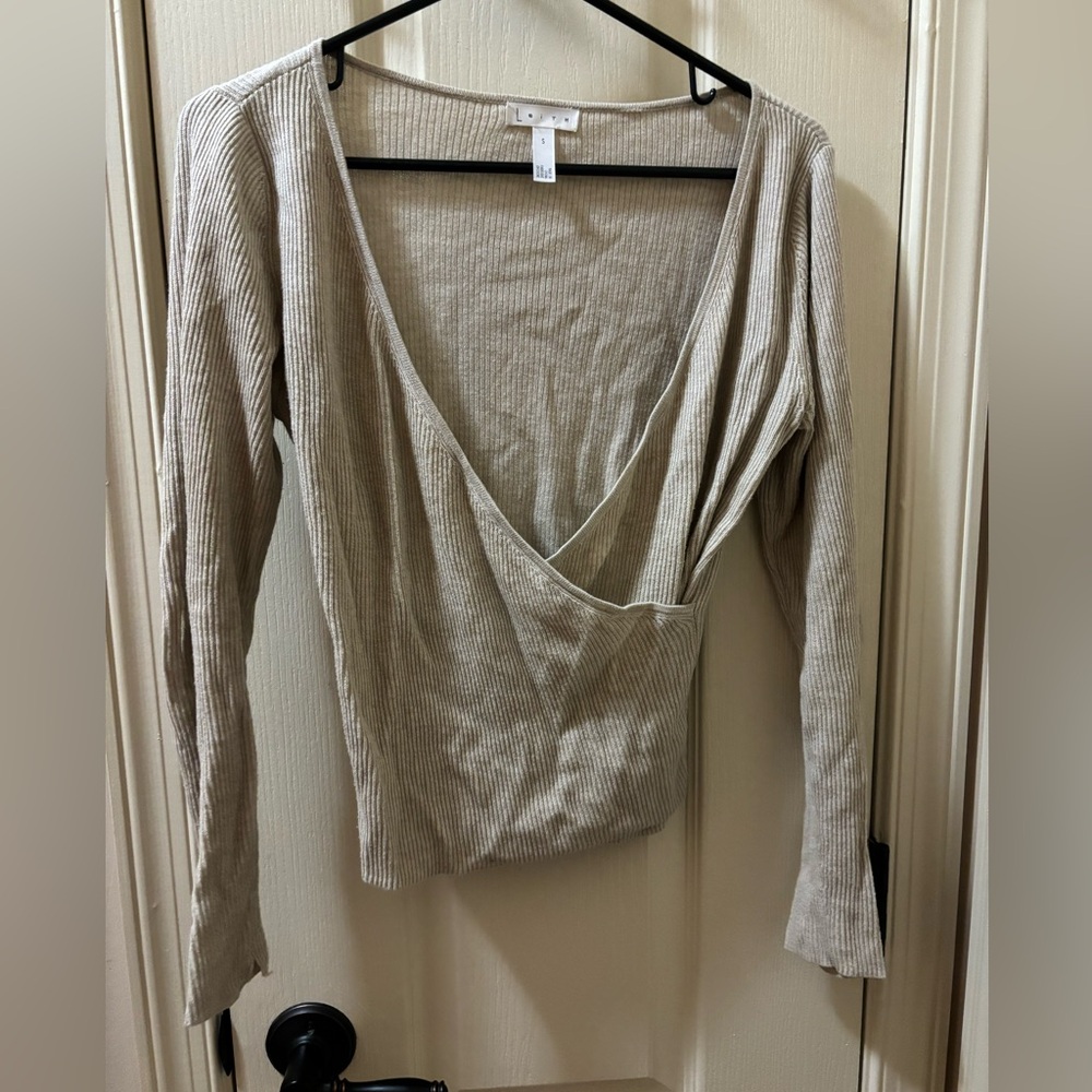 beige cross sweater